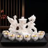 a-43.jpg Majestic Chinese Handmade Ceramic Gongfu Tea Cup Set with Silver Dragon Phoenix Lazy Semi-Automatic Design